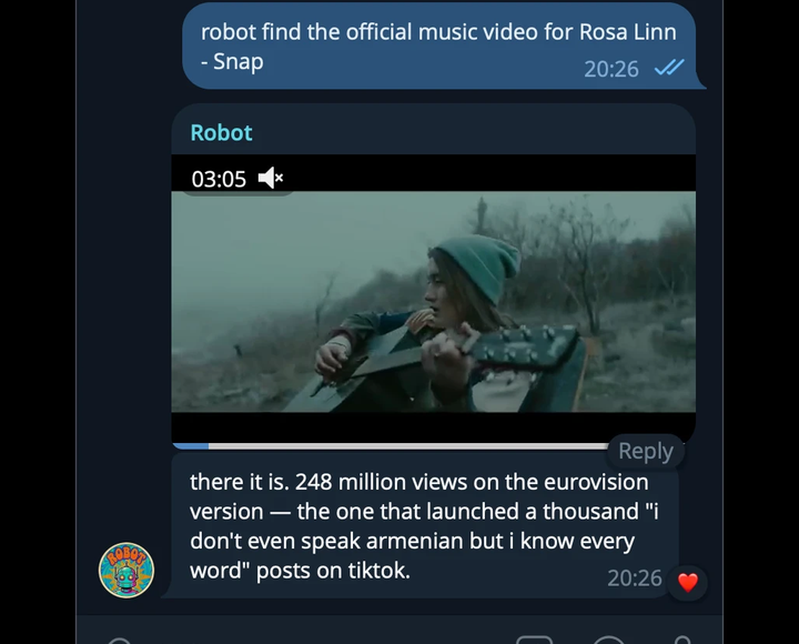 Telegram screenshot. A user asks 'robot find the official music video for Rosa Linn - Snap.' The bot posts the actual video file and writes, 'there it is. 248 million views on the eurovision version, the one that launched a thousand i dont even speak armenian but i know every word posts on tiktok.'